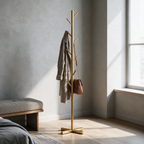 Gold branching floor standing coat stand in a bedroom corner
