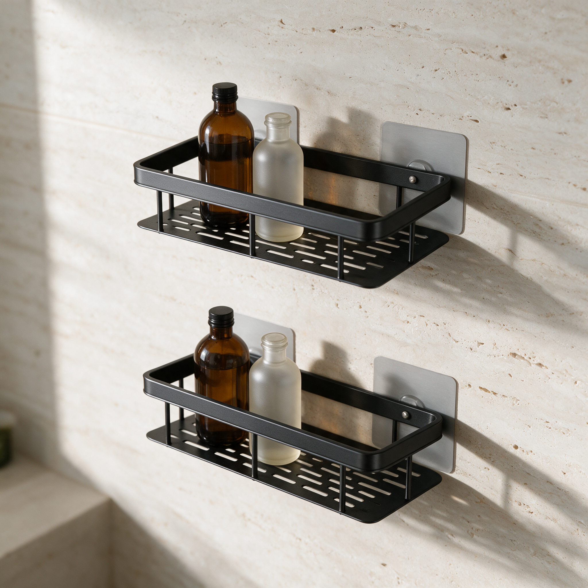 Two matte black wall-mounted rectangular bathroom shelves mounted one above the other