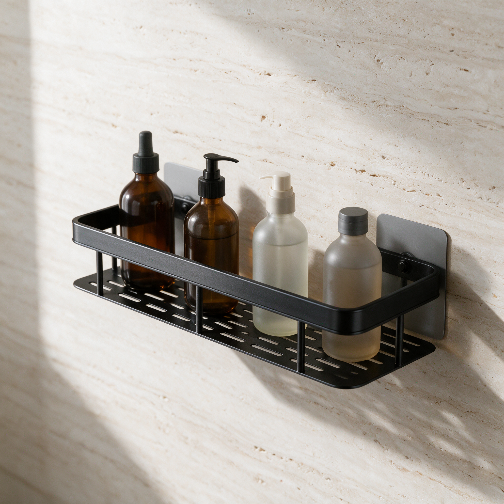 Matte black wall-mounted rectangular bathroom shelf holding glass bottles