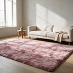 Dusty pink tie-dye shaggy rug on a pale oak floor in a living room